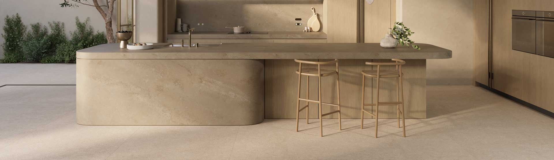 Modern beige kitchen with curved island, pendant lights, and minimalist design.