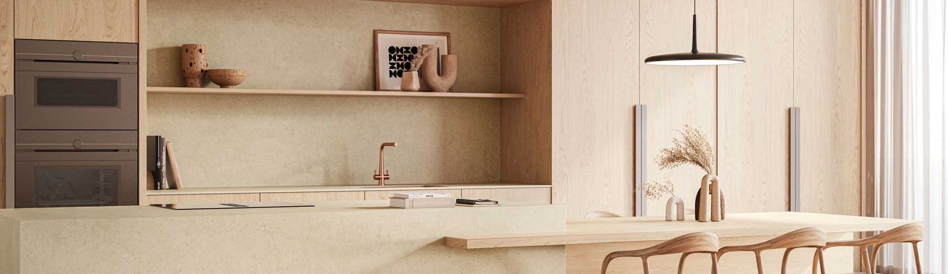 Modern kitchen with Caesarstone countertops and backsplash in soft beige tones, featuring wooden cabinets and minimalist decor.